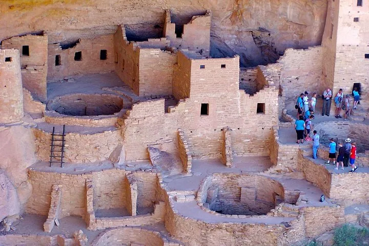A high-angle view of tourists exploring the ancient stone ruins.